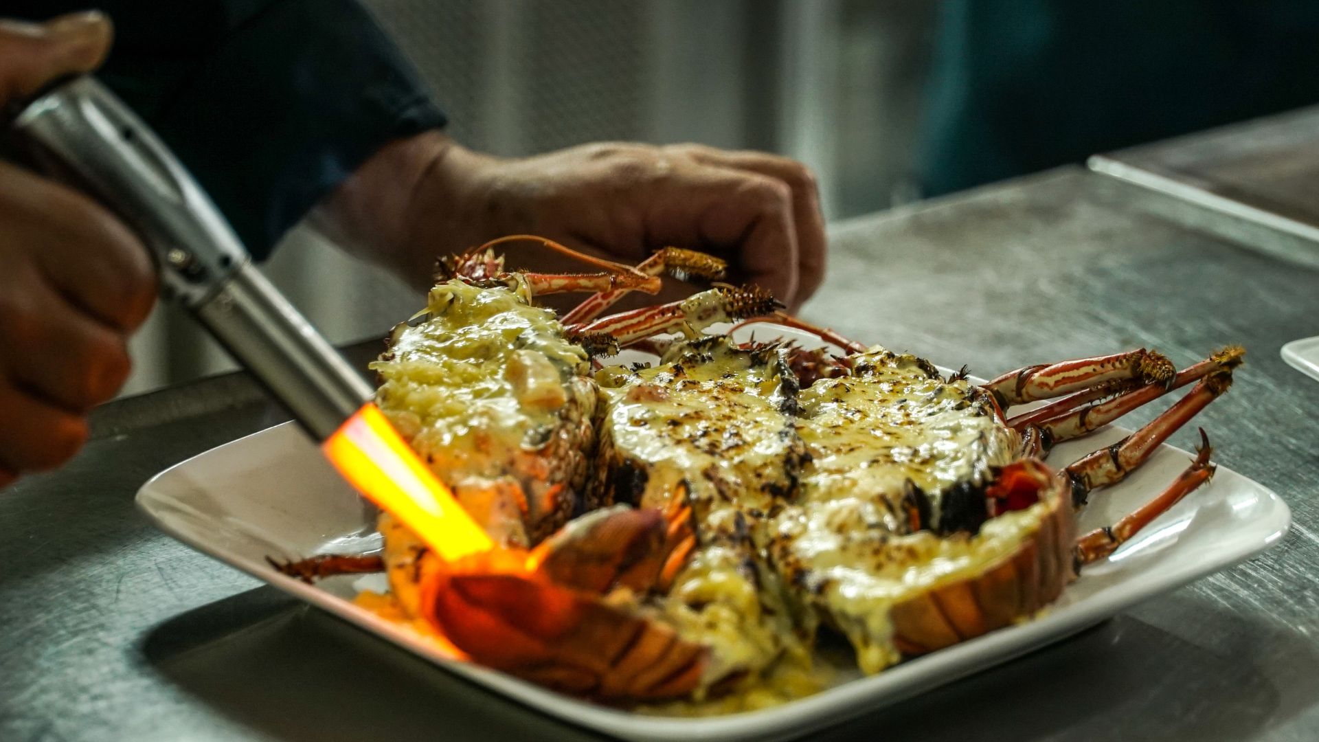 Chef Sioni melds Tongan and European cuisine in a crayfish dish at Seaview Restaurant.